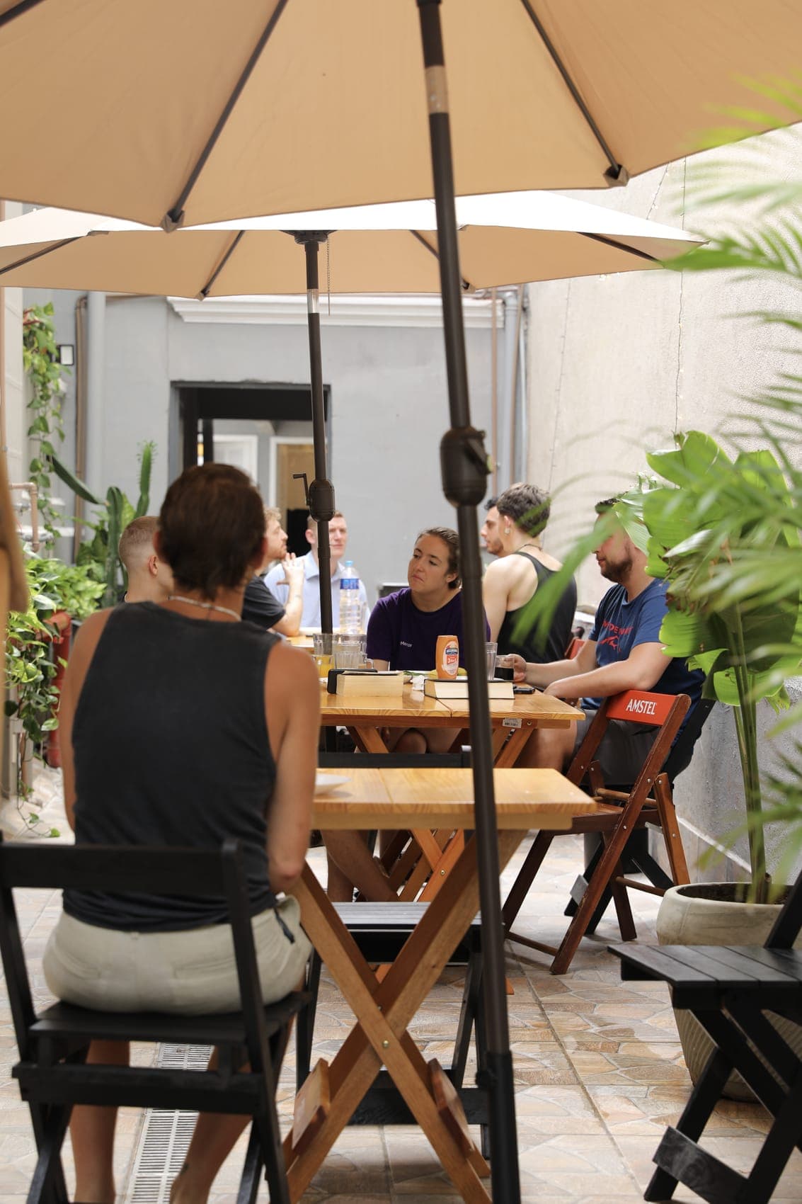Guests relaxing at the outdoor tables